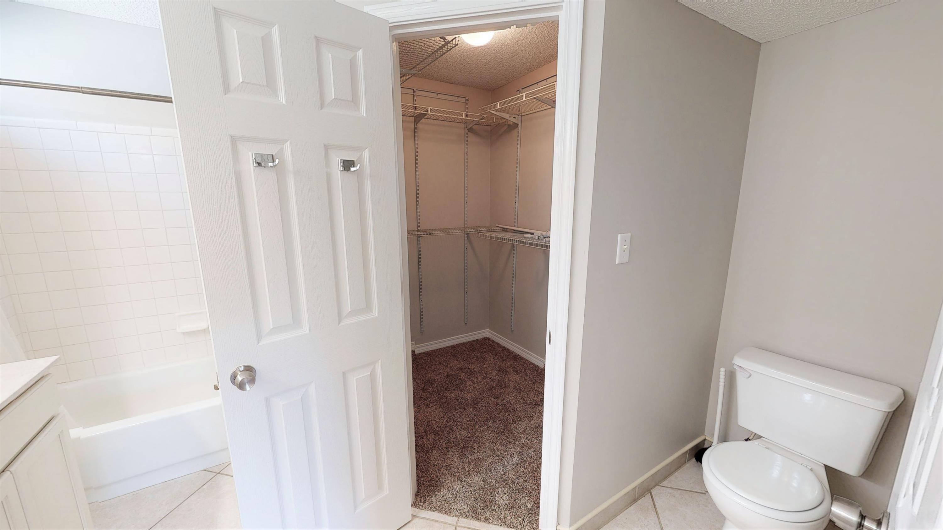 3621 Goldsbys Way Destin, FL 32541 - Photo 23 of 38 a white toilet sitting next to a bathroom sink