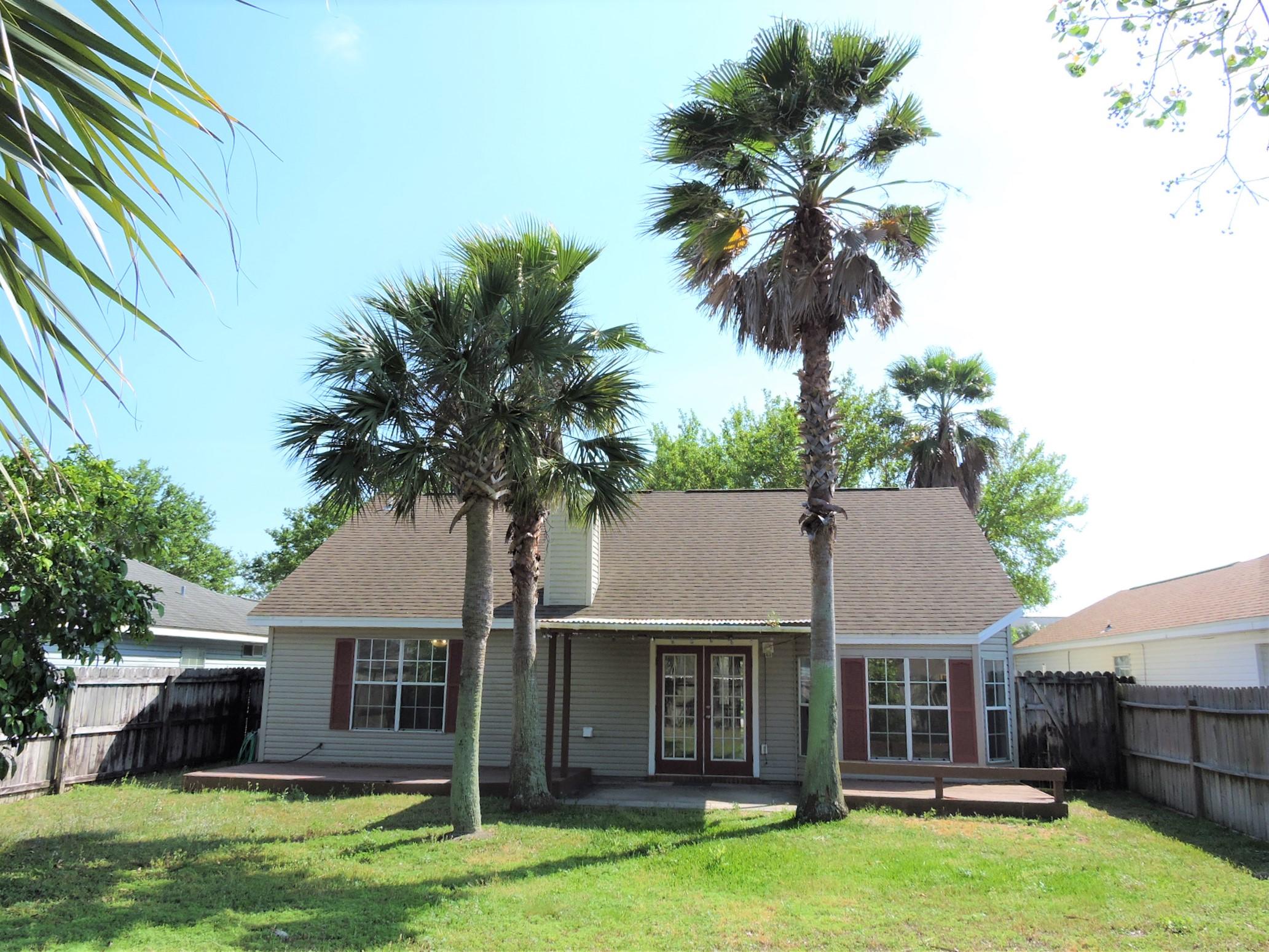 3621 Goldsbys Way Destin, FL 32541 - Photo 34 of 38 a front view of house with yard and green space