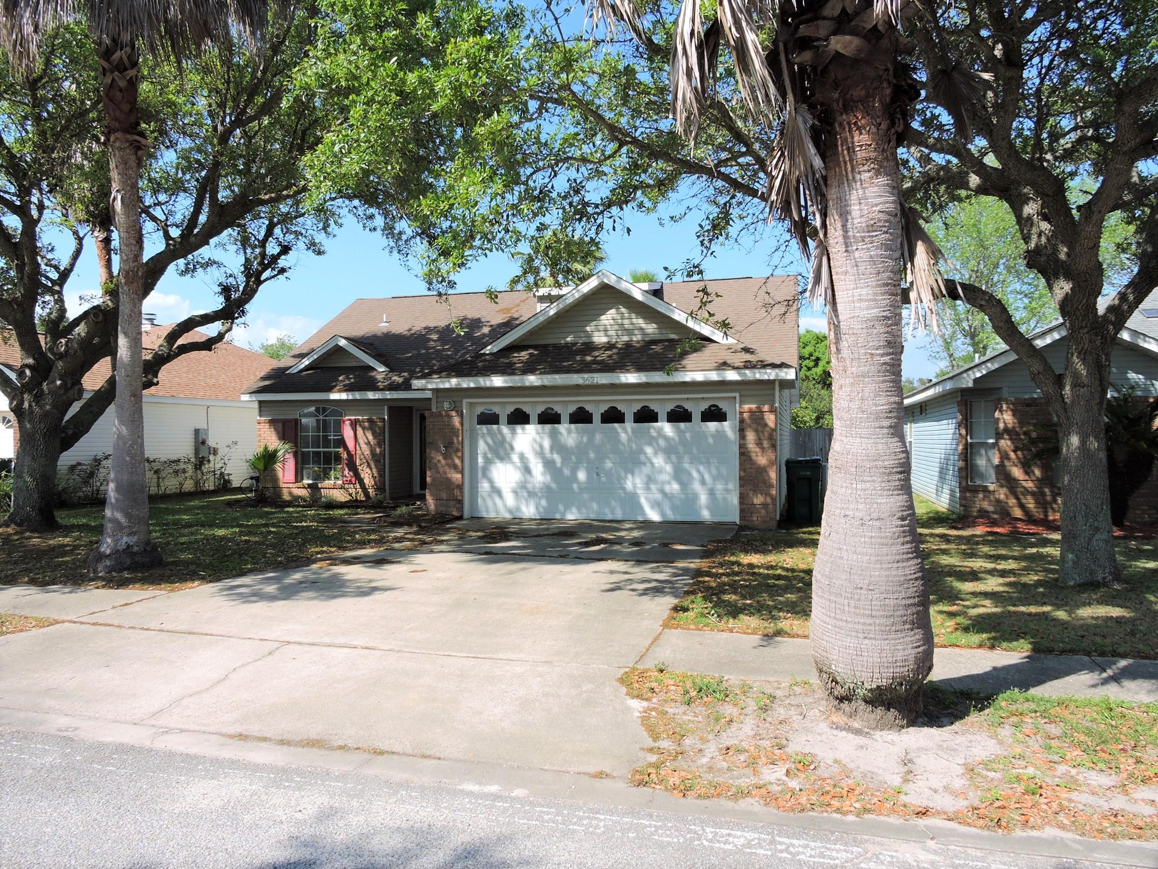3621 Goldsbys Way Destin, FL 32541 - Photo 37 of 38 a front view of a house with a yard and garage