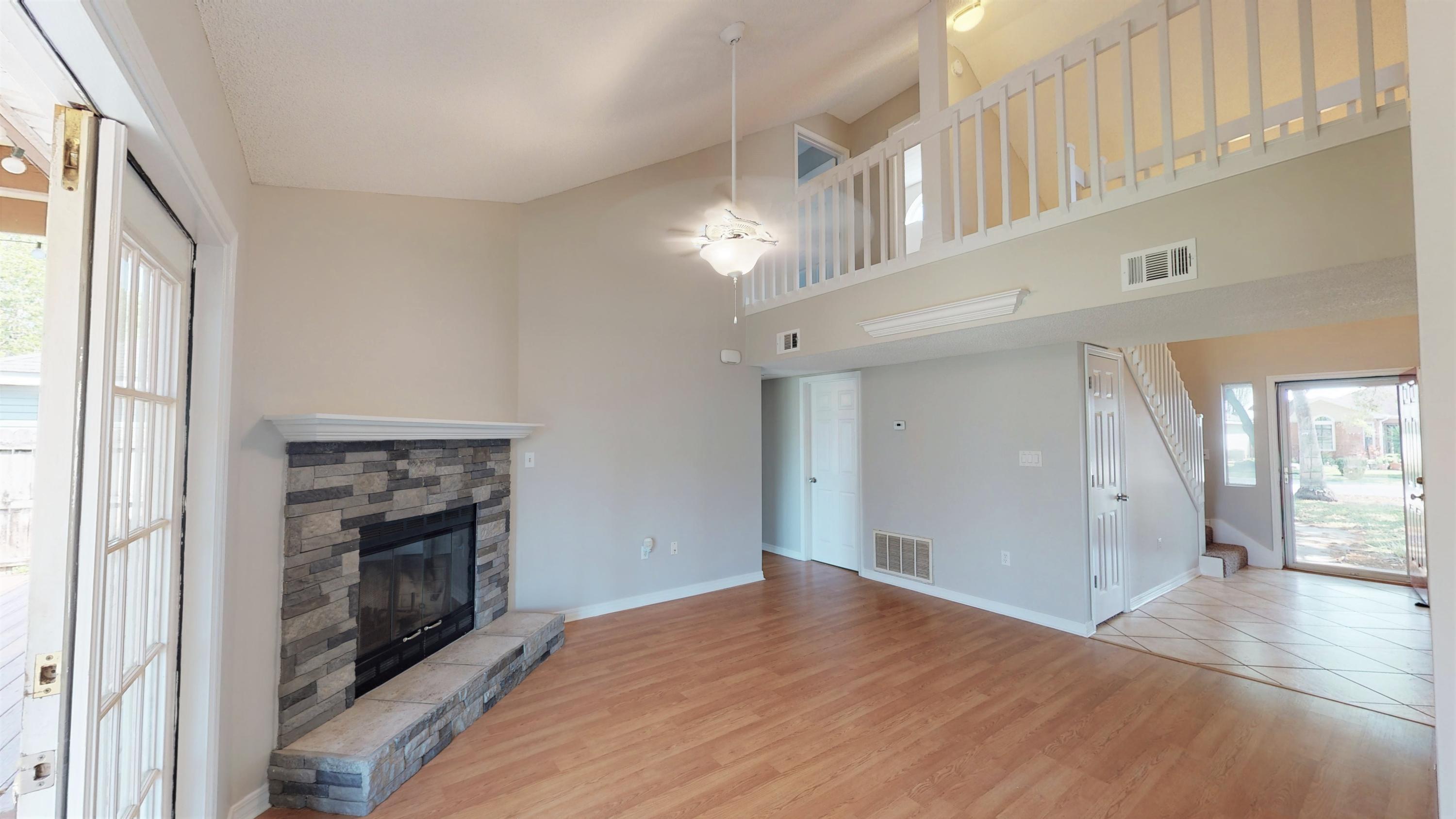 3621 Goldsbys Way Destin, FL 32541 - Photo 10 of 38 a view of an empty room with window and fire place