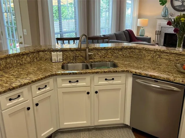 a kitchen with wooden floor