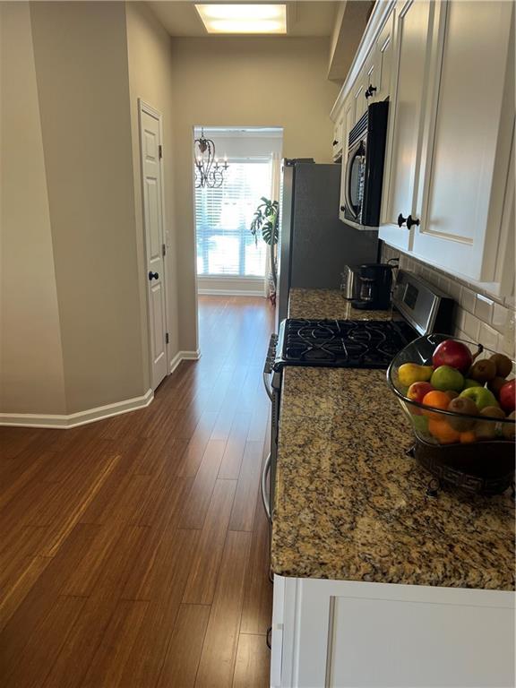 2430 Jakin Way Suwanee, GA 30024 - Photo 20 of 55 a kitchen with wooden floor