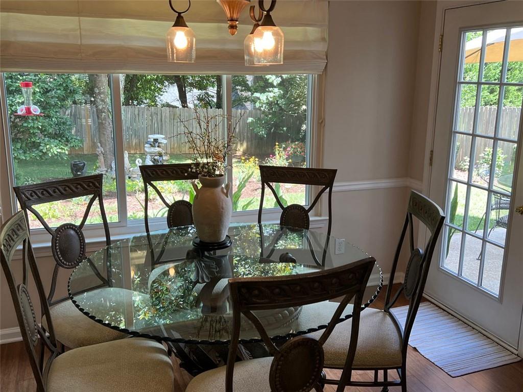 2430 Jakin Way Suwanee, GA 30024 - Photo 25 of 55 a view of a dining room with furniture window and outside view
