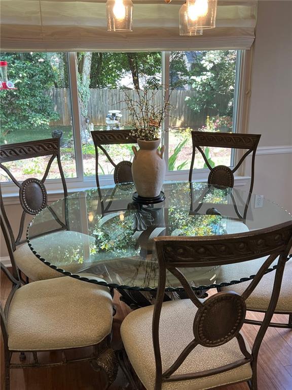 2430 Jakin Way Suwanee, GA 30024 - Photo 26 of 55 a living room with furniture and a floor to ceiling window