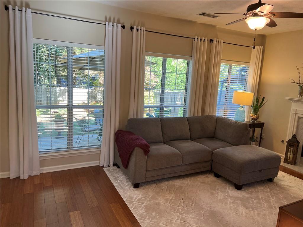 2430 Jakin Way Suwanee, GA 30024 - Photo 29 of 55 a living room with furniture and a window