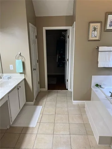 a view of swimming pool with wooden floor and seating space