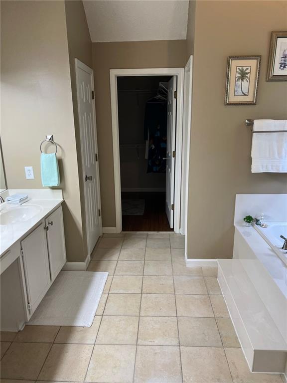 2430 Jakin Way Suwanee, GA 30024 - Photo 36 of 55 a kitchen with a cabinets and a stove top oven