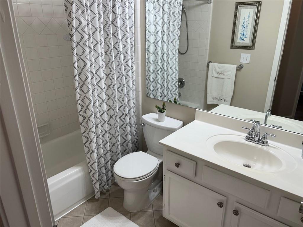 2430 Jakin Way Suwanee, GA 30024 - Photo 42 of 55 a white toilet sitting next to a bathroom sink