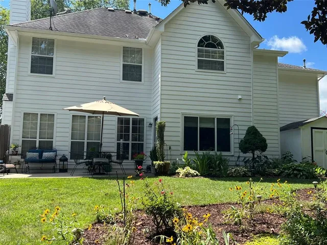 a view of backyard with green space