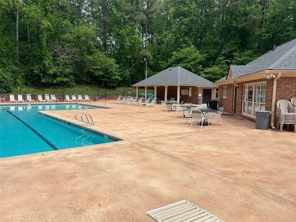 2430 Jakin Way Suwanee, GA 30024 - Photo 54 of 55 a view of a swimming pool with a lounge chair
