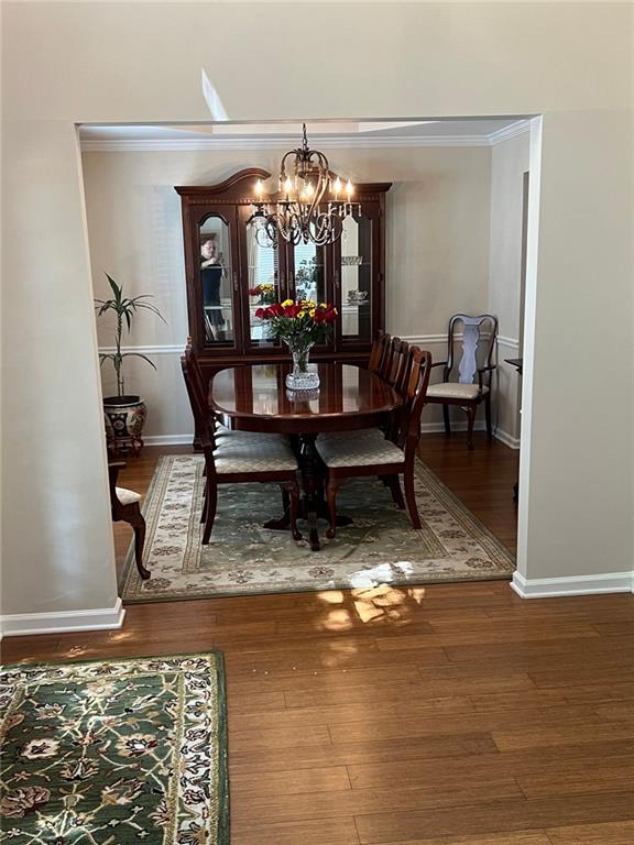 2430 Jakin Way Suwanee, GA 30024 - Photo 9 of 55 a view of a dining room with furniture and chandelier kitchen view