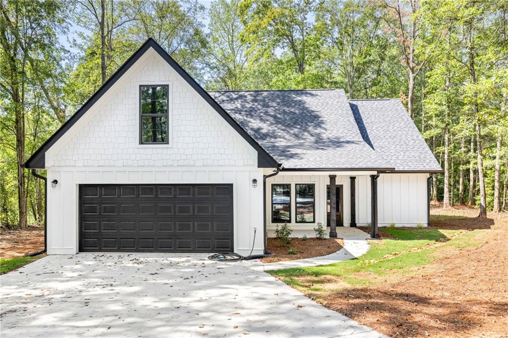 219 Ruby Lane Commerce, GA 30530 - Photo 1 of 1 a front view of a house with a yard and garage
