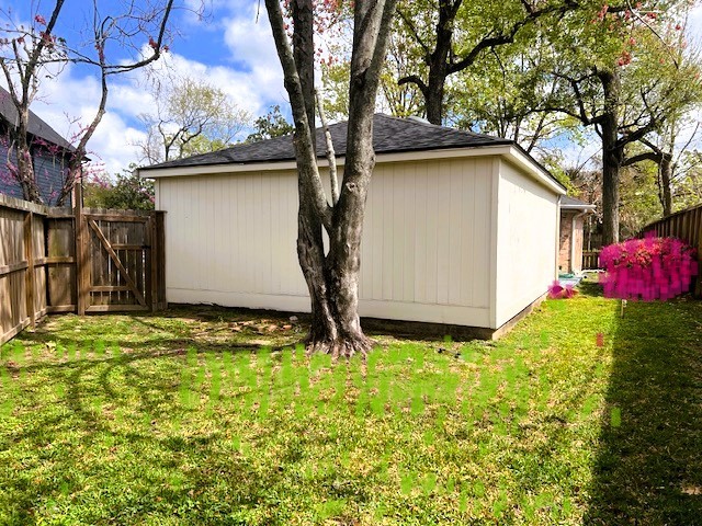 8639 Cedarbrake Drive Spring Valley Village, TX 77055 - Photo 22 of 26 Discover your private oasis in this charming backyard retreat behind the garage, perfect for relaxation and outdoor gatherings.