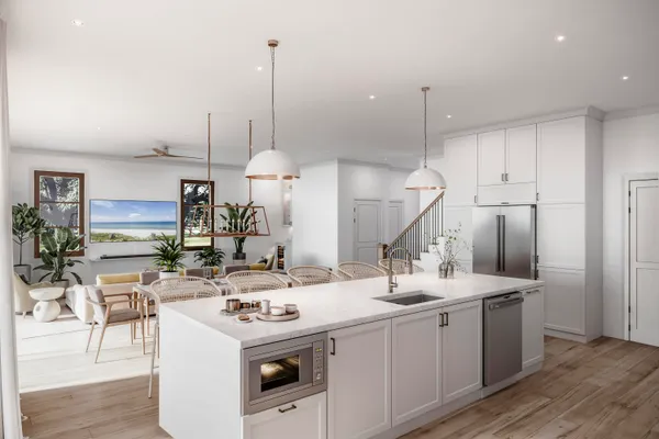 a kitchen island with a sink a counter top space and stainless steel appliances