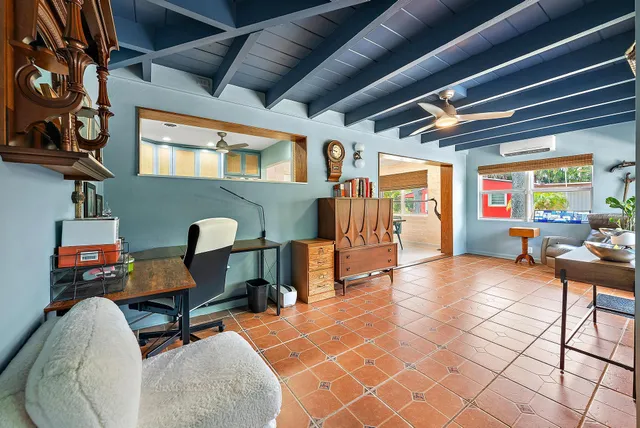 a reading room with furniture and a window