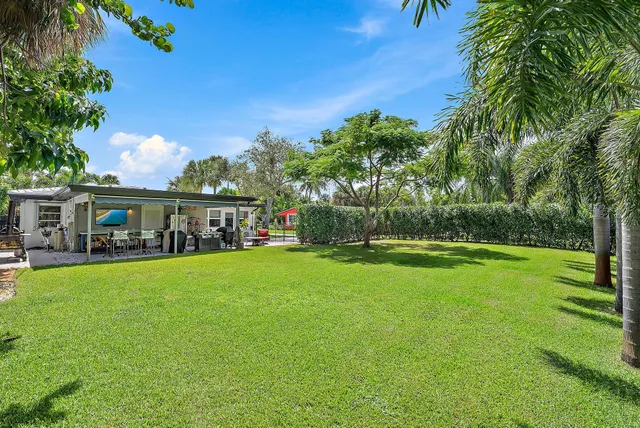 a front view of house with yard and seating area