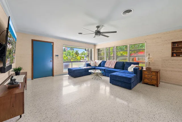 a living room with furniture and a flat screen tv