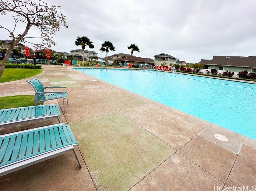 91-1560 Laauala Street Ewa Beach, HI 96706 - Photo 12 of 20 a view of swimming pool outdoor seating and city view
