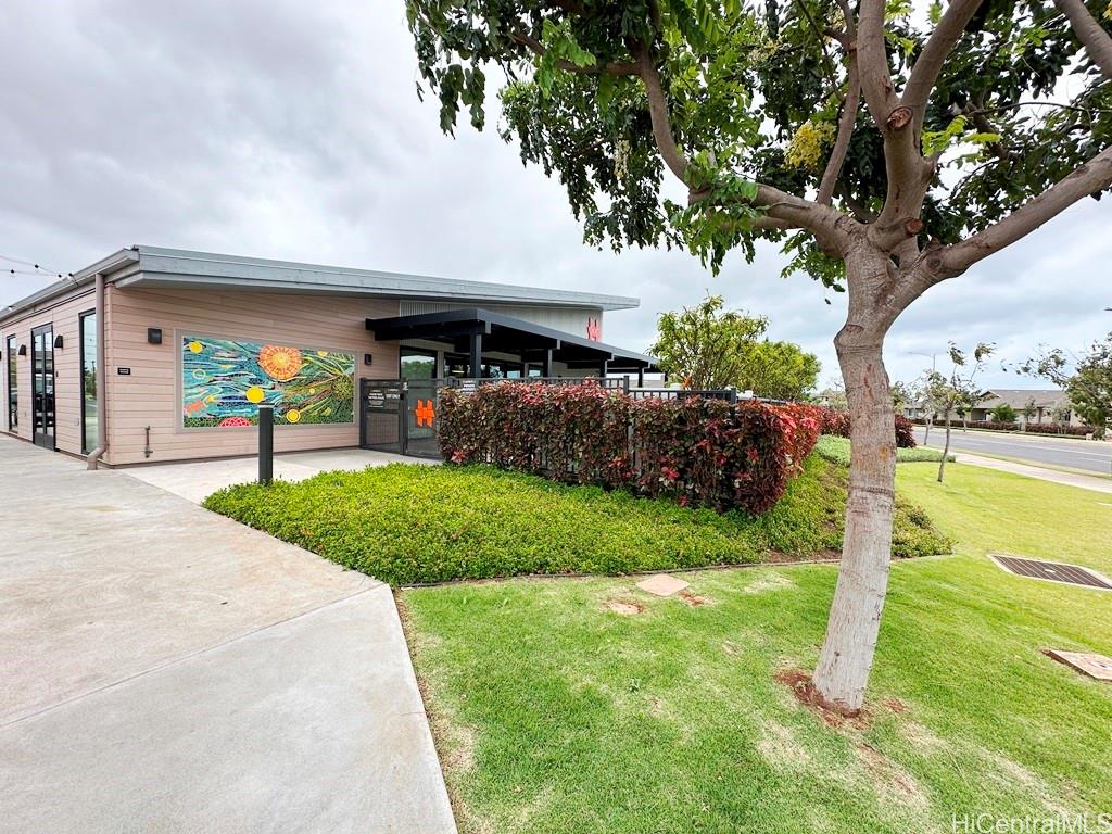 91-1560 Laauala Street Ewa Beach, HI 96706 - Photo 17 of 20 a front view of a house with a yard and a large tree