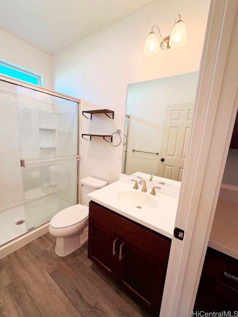 91-1560 Laauala Street Ewa Beach, HI 96706 - Photo 8 of 20 a bathroom with a sink a toilet and shower