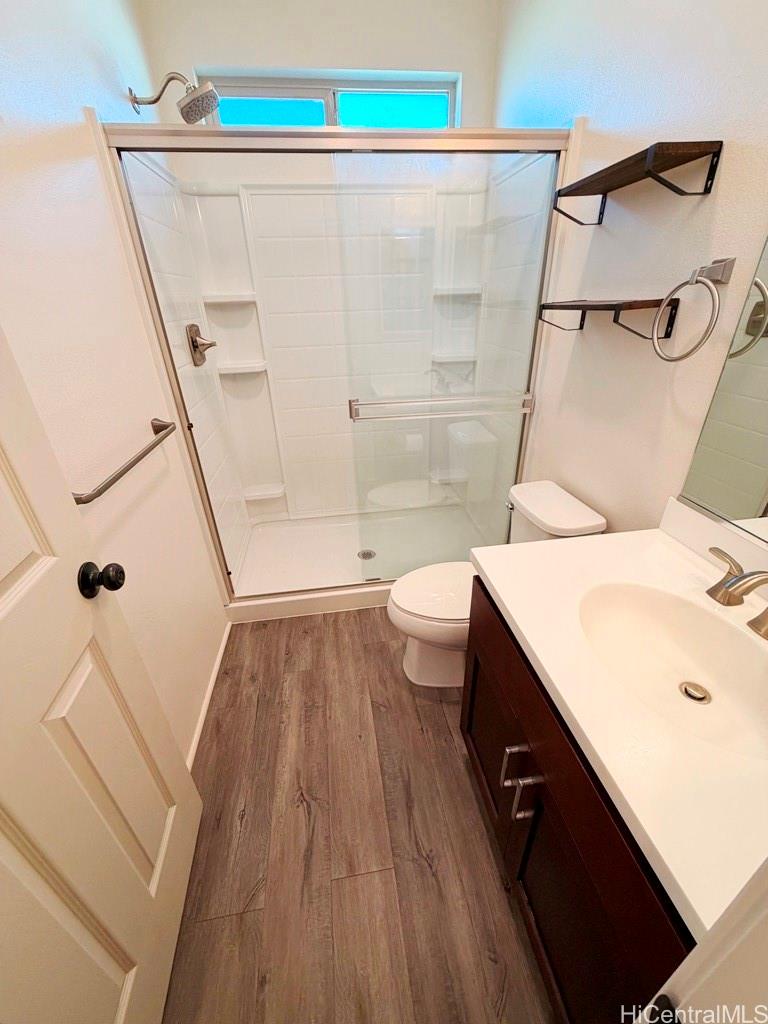 91-1560 Laauala Street Ewa Beach, HI 96706 - Photo 9 of 20 a bathroom with a sink a toilet and shower