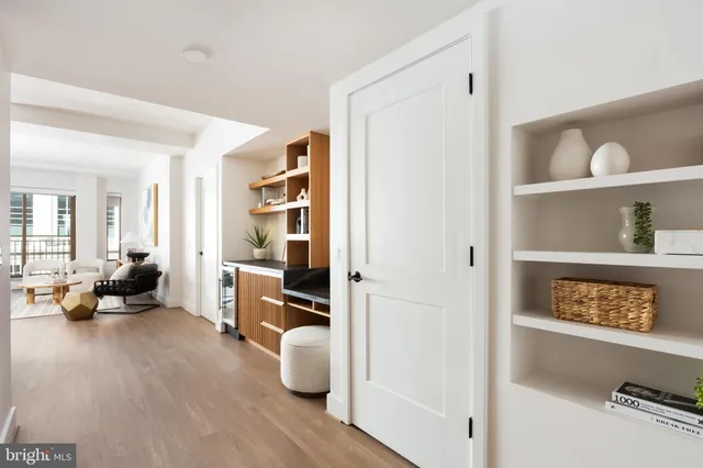 a bedroom with a bed and a night stand