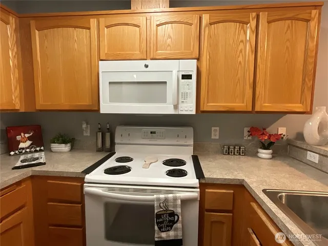 a kitchen with a stove top oven