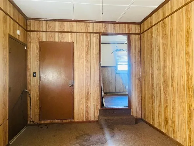 a view of a bathroom with a glass door and shower