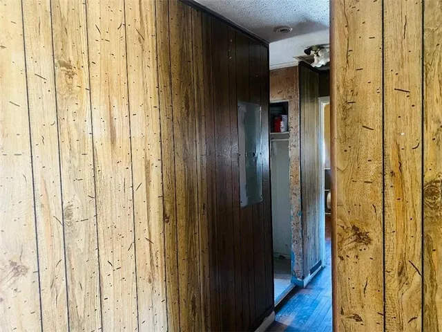a bathroom with a shower and a glass door