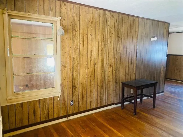 a view of a elevator with wooden floor
