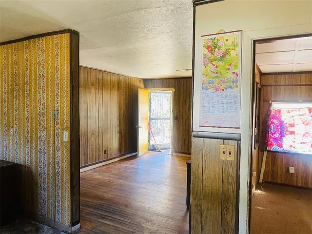 a view of an entryway with wooden floor