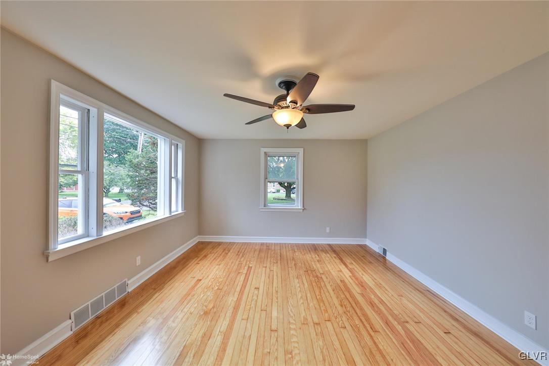 475 Cherry Hill Road Nazareth, PA 18064 - Photo 12 of 46 a view of empty room with wooden floor and fan