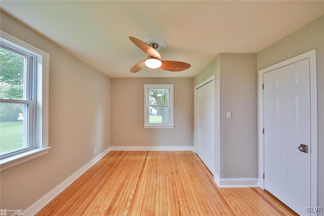 475 Cherry Hill Road Nazareth, PA 18064 - Photo 19 of 46 a view of empty room with wooden floor and fan