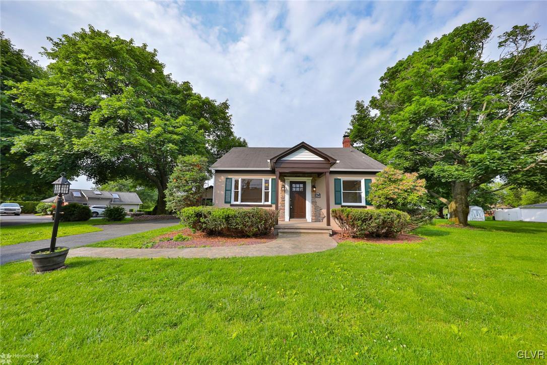 475 Cherry Hill Road Nazareth, PA 18064 - Photo 2 of 46 a front view of a house with a yard table and chairs