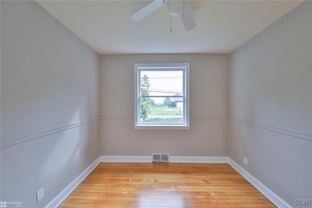 475 Cherry Hill Road Nazareth, PA 18064 - Photo 24 of 46 a view of empty room with wooden floor and fan