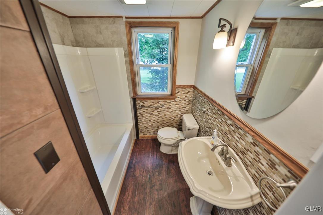 475 Cherry Hill Road Nazareth, PA 18064 - Photo 26 of 46 a bathroom with a toilet sink and mirror