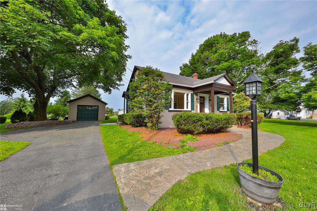 475 Cherry Hill Road Nazareth, PA 18064 - Photo 3 of 46 a front view of a house with garden
