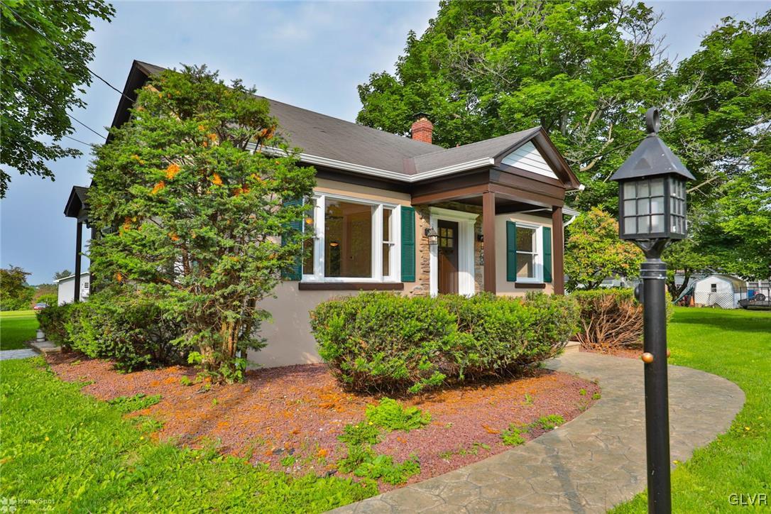 475 Cherry Hill Road Nazareth, PA 18064 - Photo 4 of 46 a front view of a house with garden