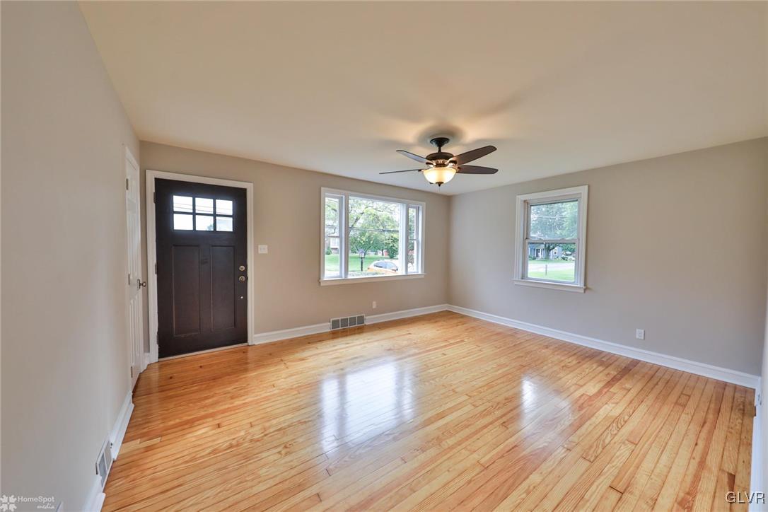 475 Cherry Hill Road Nazareth, PA 18064 - Photo 7 of 46 a view of an empty room with wooden floor and a window
