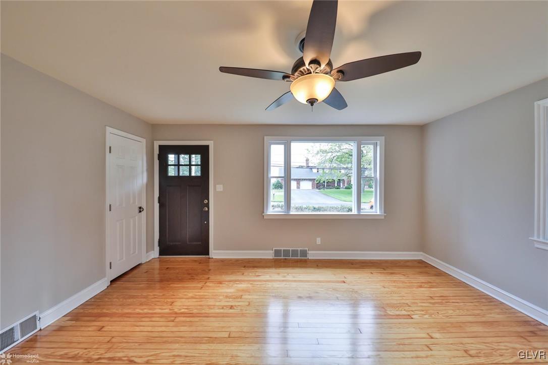 475 Cherry Hill Road Nazareth, PA 18064 - Photo 8 of 46 a view of an empty room with wooden floor and a window