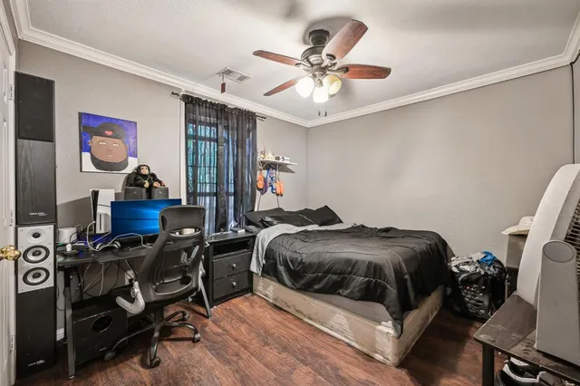 a bedroom with a bed and furniture