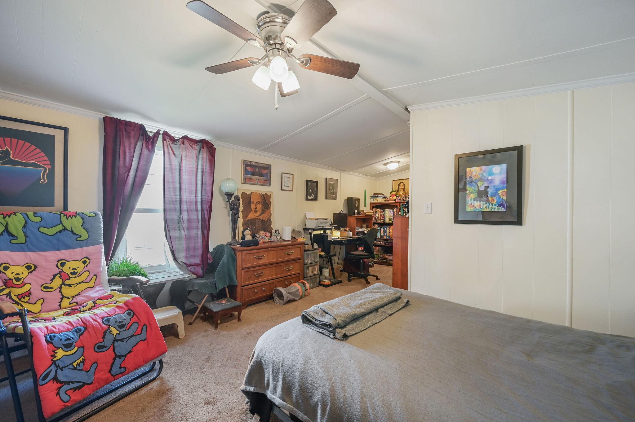 437 Ranee Loop, Unit 66 Bear, DE 19701 - Photo 13 of 20 a bedroom with furniture and a chandelier