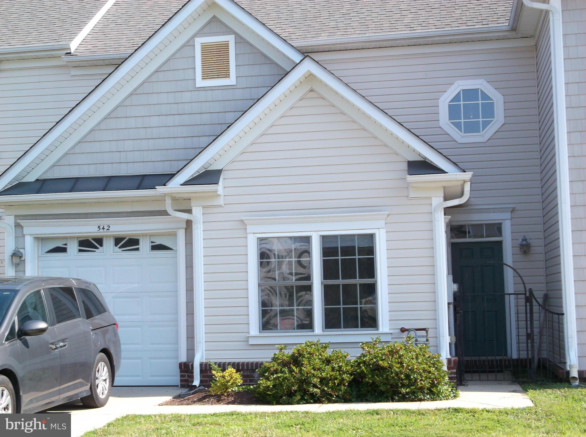 542 Summerset Court, Unit 39 Solomons, MD 20629 - Photo 2 of 39 a front view of a house with a yard