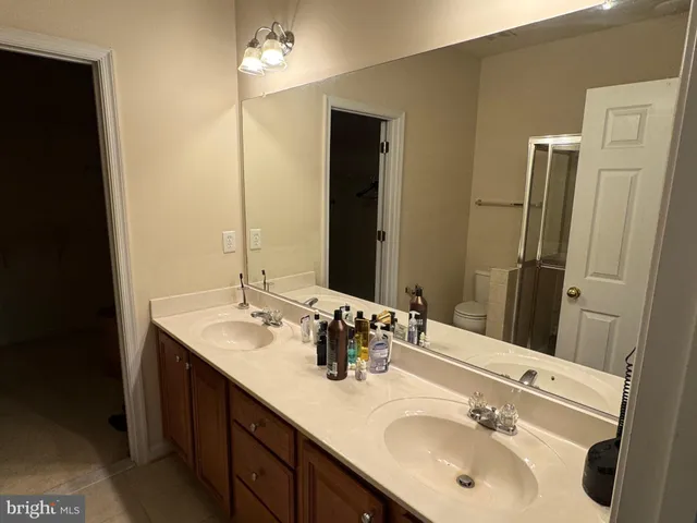a bathroom with a shower and a toilet