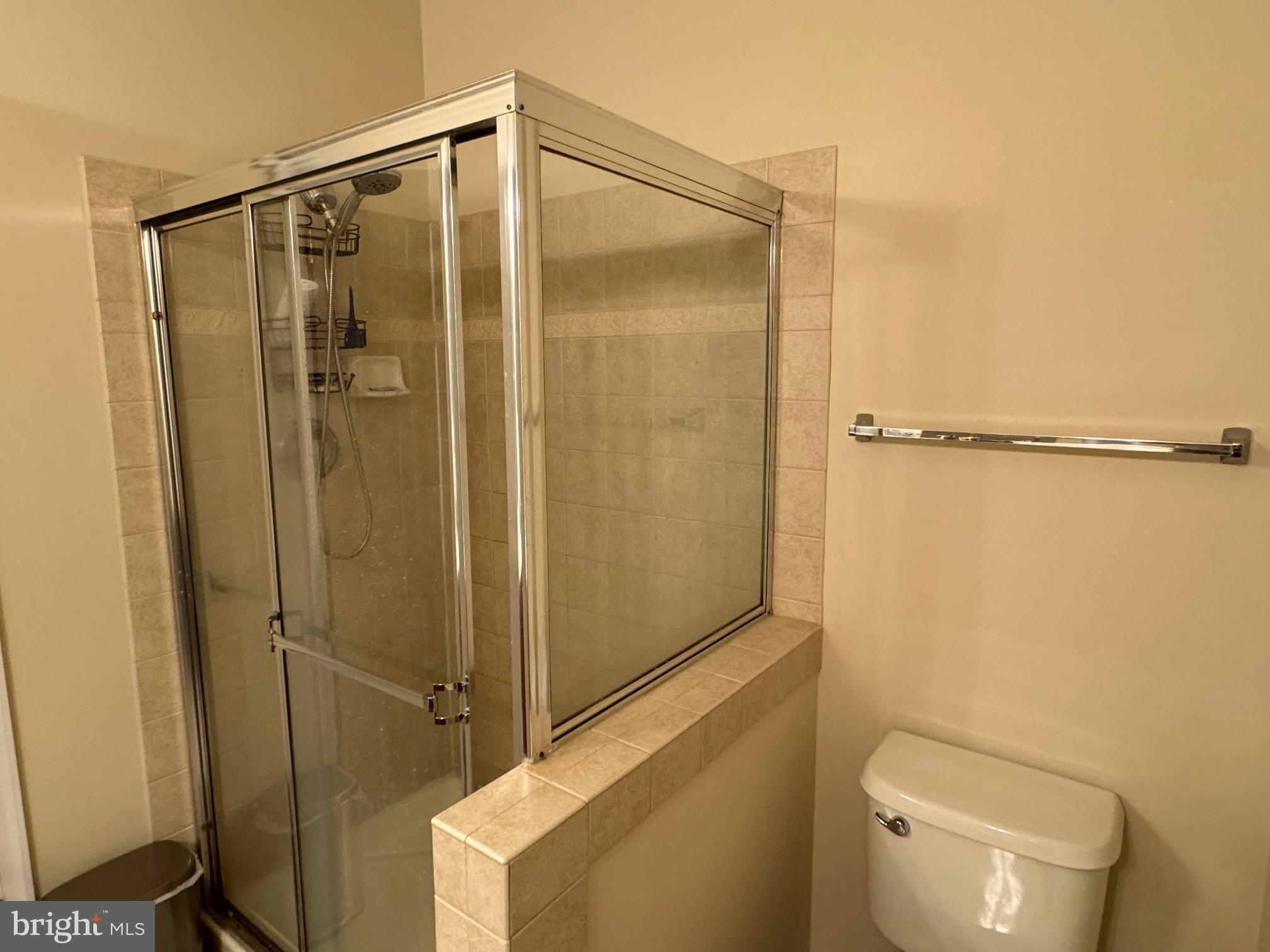 542 Summerset Court, Unit 39 Solomons, MD 20629 - Photo 24 of 39 a bathroom with a shower and a toilet