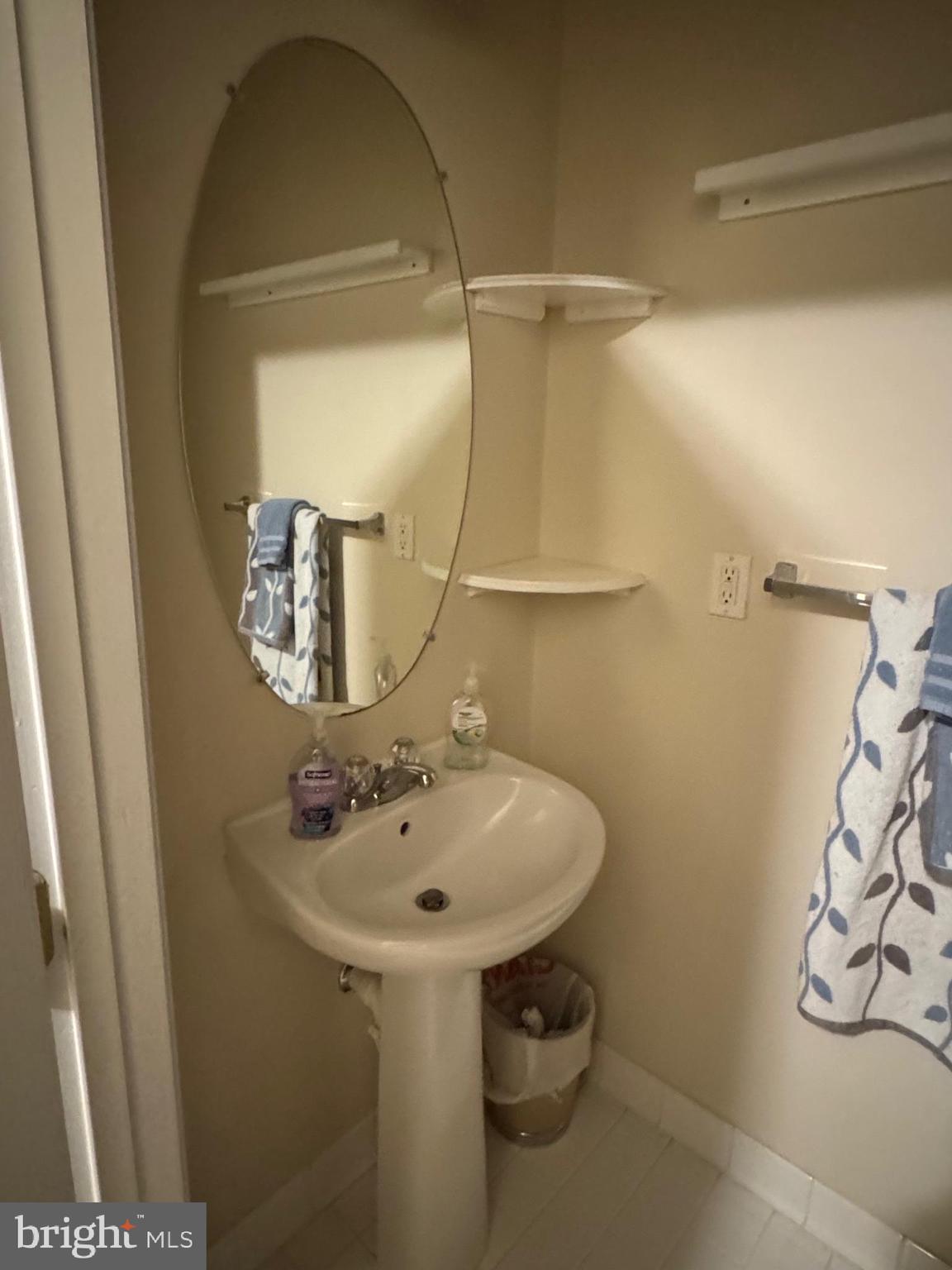 542 Summerset Court, Unit 39 Solomons, MD 20629 - Photo 25 of 39 a bathroom with a sink and mirror