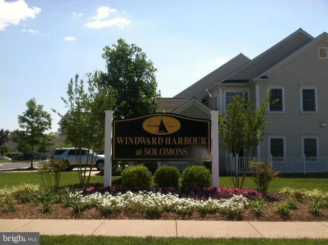 a sign that is sitting in front of a house