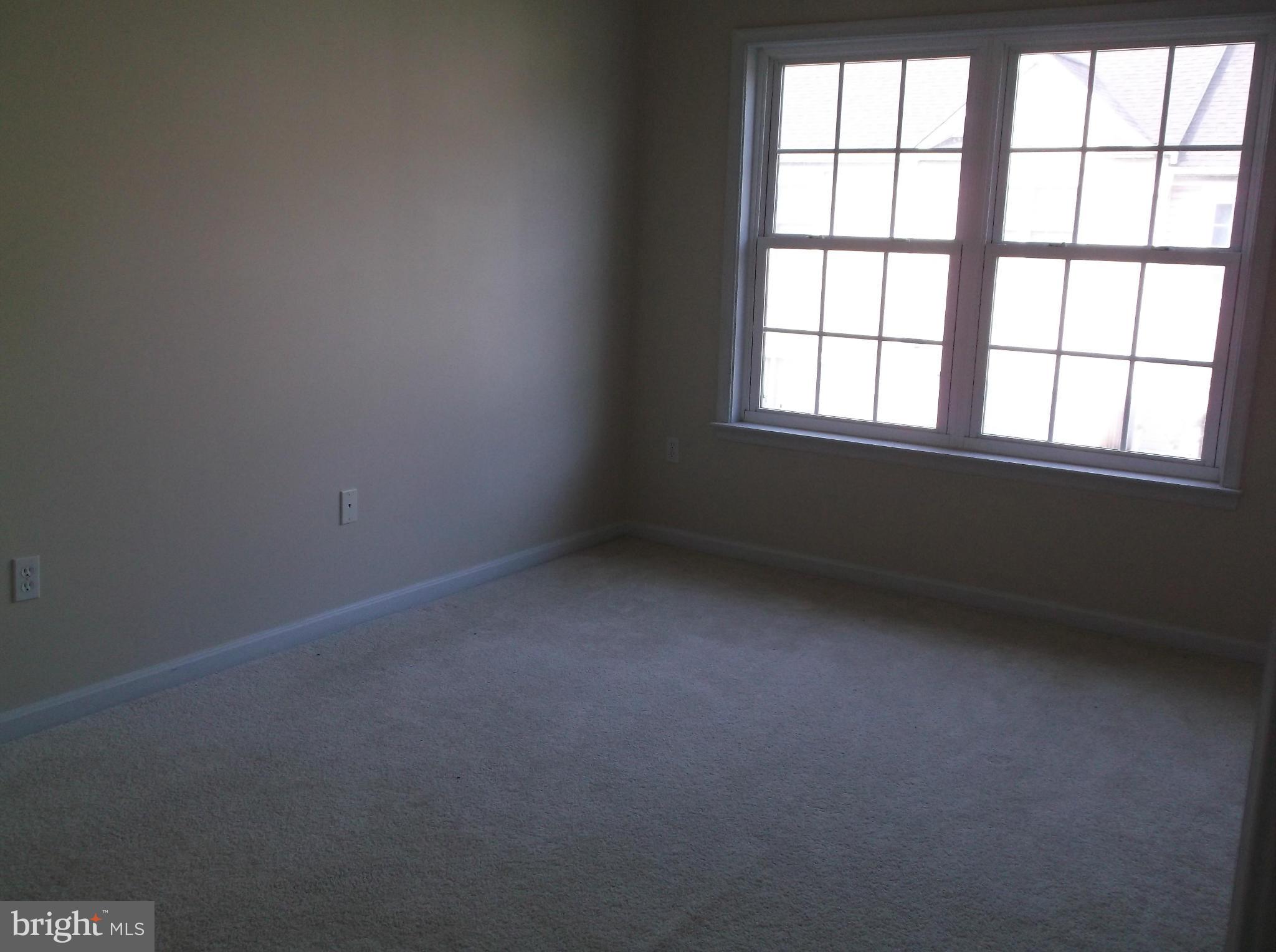 542 Summerset Court, Unit 39 Solomons, MD 20629 - Photo 31 of 39 an empty room with a window