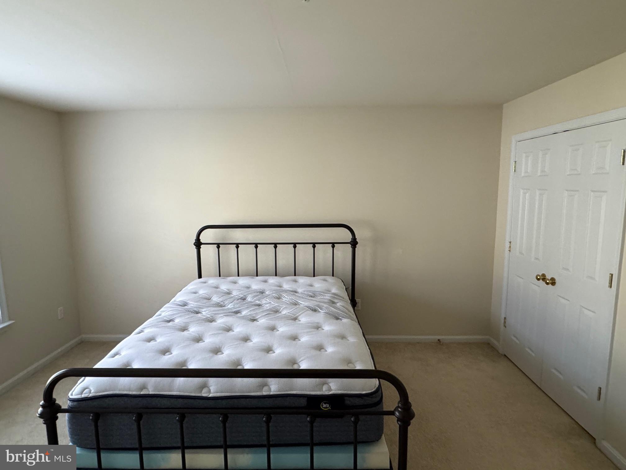 542 Summerset Court, Unit 39 Solomons, MD 20629 - Photo 33 of 39 a bedroom with a bed and window