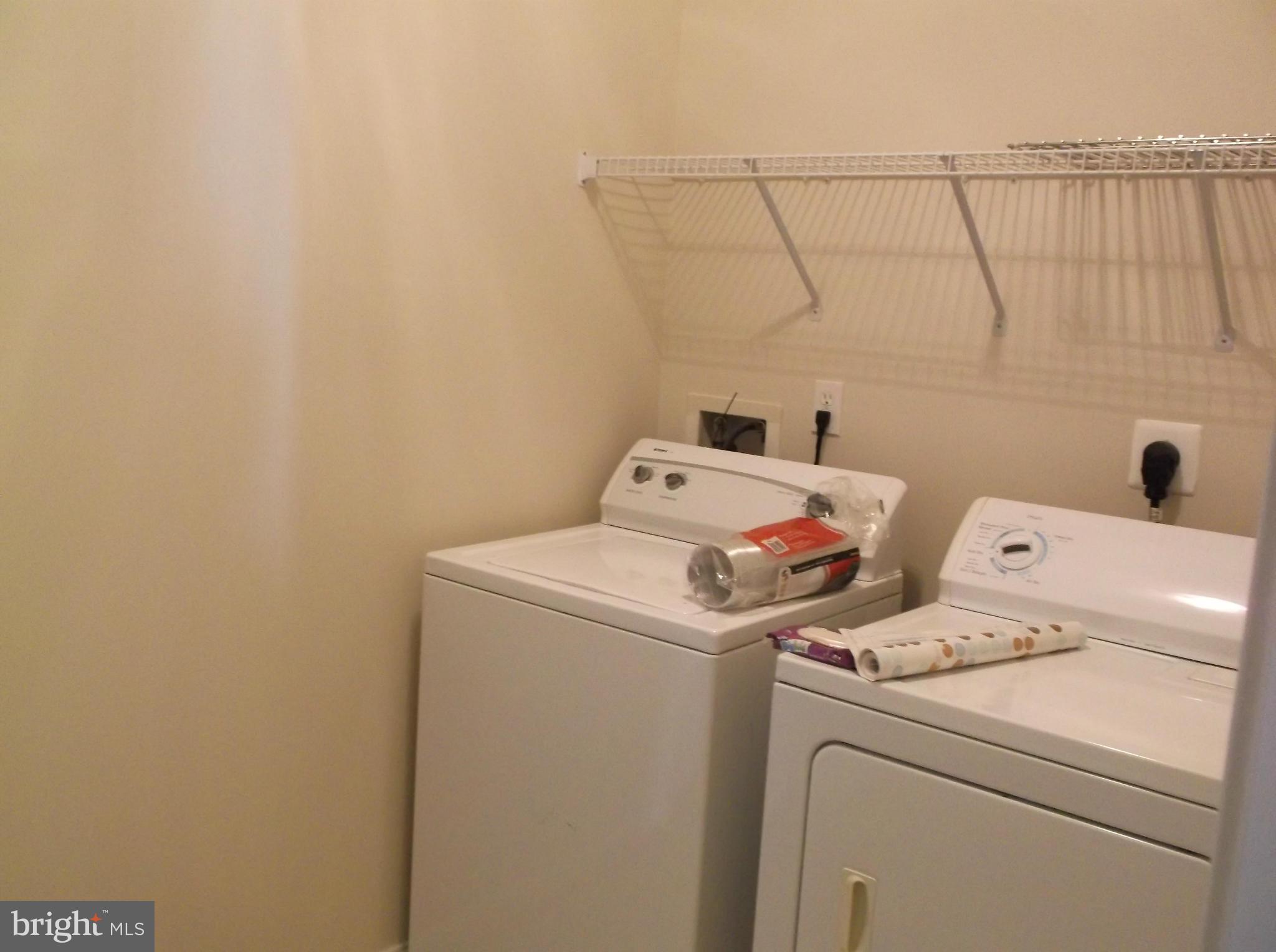 542 Summerset Court, Unit 39 Solomons, MD 20629 - Photo 38 of 39 a utility room with dryer and washer